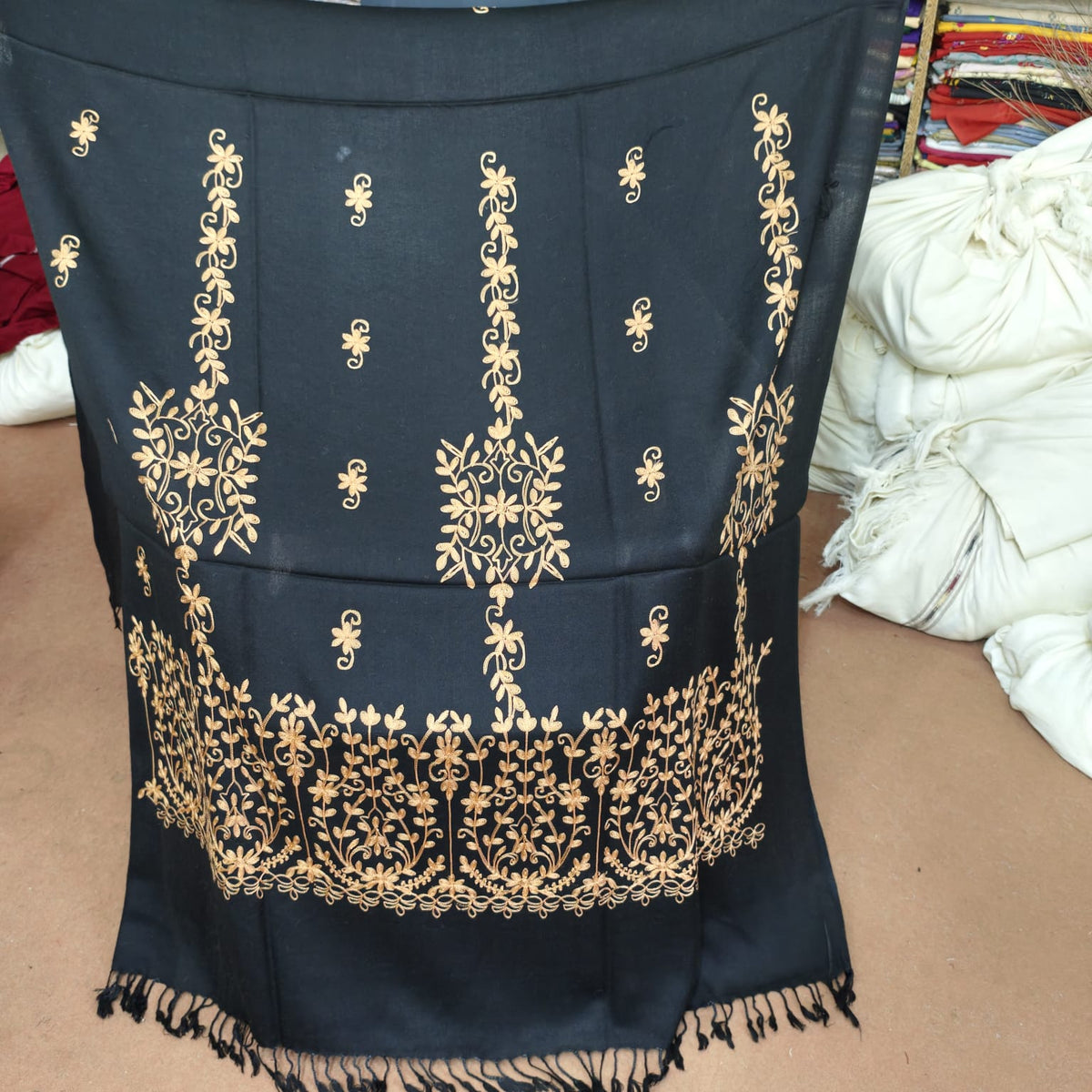 Women's black shawl with gold floral embroidery, full view